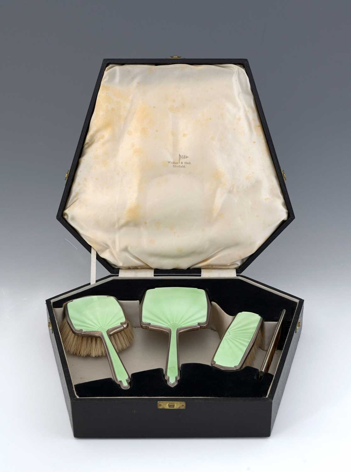 Lot 81 - An Art Deco silver and enamelled dressing...