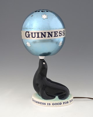 Lot 556 - A Guinness advertising figural table lamp and...