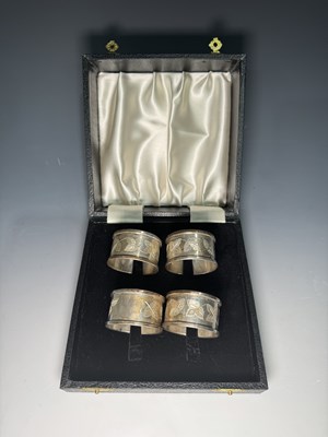 Lot 370 - A cased set of four Elizabeth II silver napkin...
