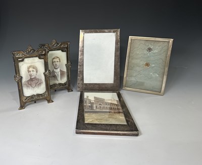 Lot 359 - A pair of silver photograph frames, one with a...