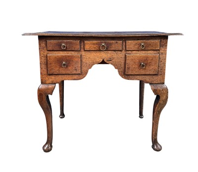 Lot 580 - A small provincial oak lowboy, three short...