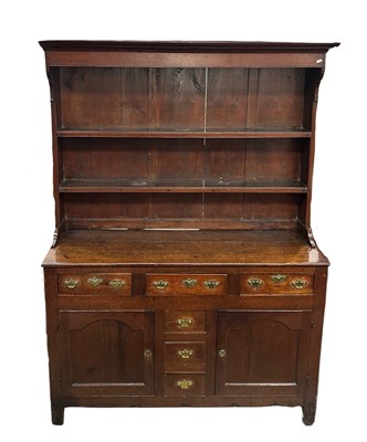 Lot 594 - A small provincial oak dresser, the top with...