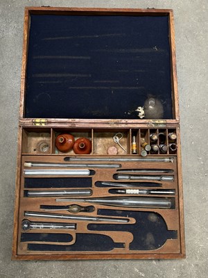Lot 10 - A polished pine cased electrotherapy machine,...