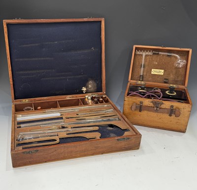 Lot 10 - A polished pine cased electrotherapy machine,...