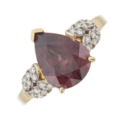 Lot 65 - An 18ct gold red zircon and diamond dress ring