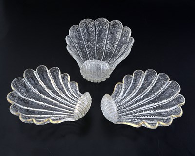 Lot 404 - A set of three French shell form glass dishes,...
