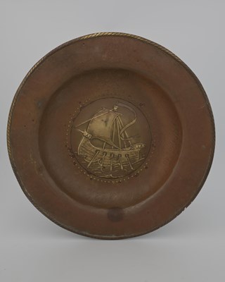 Lot 95 - An Arts and Crafts brass charger, repousse...