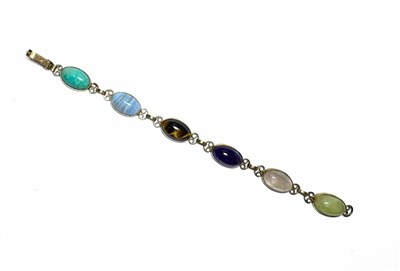Lot 441 - A 9ct gold multi-gem cabochon bracelet