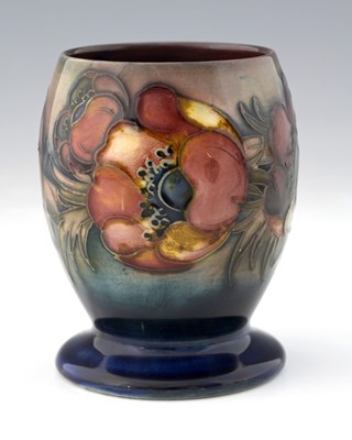 Lot 526 - William Moorcroft, a Flambe Anemone vase,...