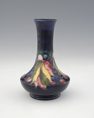 Lot 528 - William Moorcroft, a Leaf and Berry vase,...