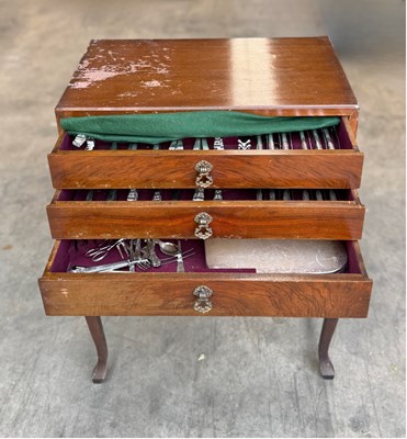 Lot 600 - A canteen of cutlery on legs, three drawers...