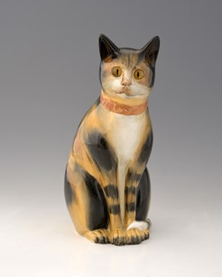 Lot 621 - A Copeland earthenware model of a tabby cat,...