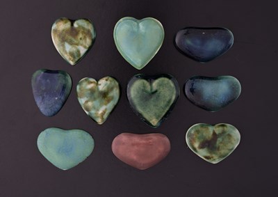 Lot 512 - Ruskin Pottery, ten heart shaped Souffle...