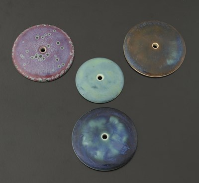Lot 520 - Ruskin Pottery, four circular plaques or clock...