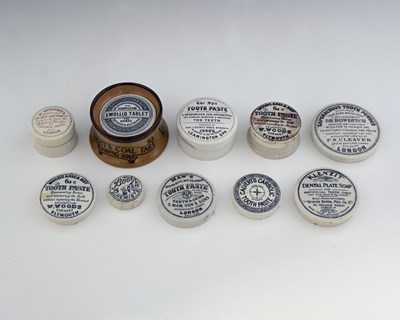 Lot 179 - A collection of toothpaste pot lids, including...