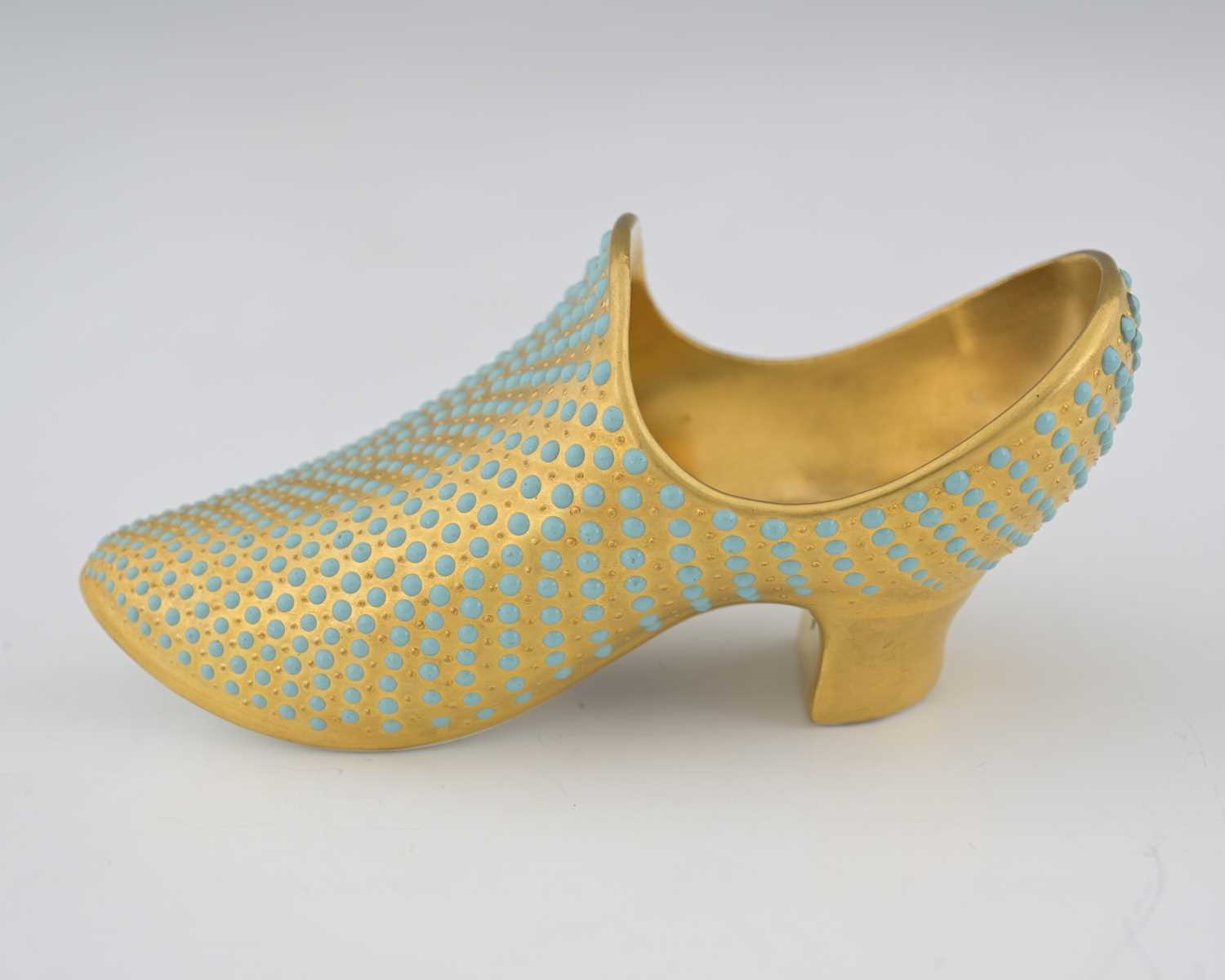 Lot 587 - A Coalport jewelled and gilt toy shoe, of...