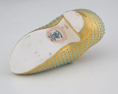 Lot 587 - A Coalport jewelled and gilt toy shoe, of...