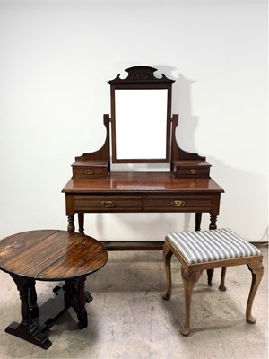 Lot 777 - A low oak fold out drop leaf side table,...