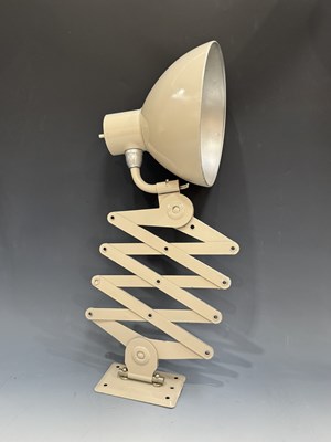 Lot 535 - A vintage cream painted wall mounted scissor...
