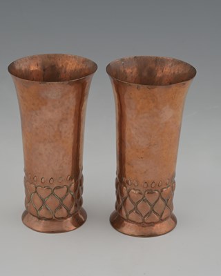 Lot 91 - A pair of Arts and Crafts copper vases, in the...