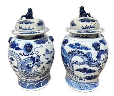 Lot 181 - A pair of blue and white temple/ginger jars...