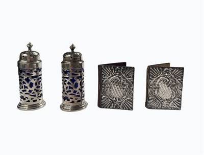 Lot 487 - A pair of pierced silver pepper and salt pots,...