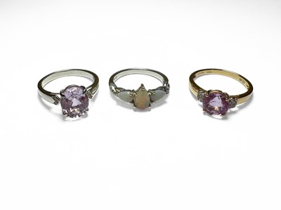 Lot 418 - A 9ct gold kunzite and white zircon dress ring, together with two silver gem-set rings