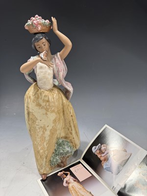 Lot 124 - A Lladro figure 'Florista Caminante Y Pajarito'...
