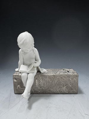Lot 126 - A bisque Lladro figure 'Girl Learning' a child...