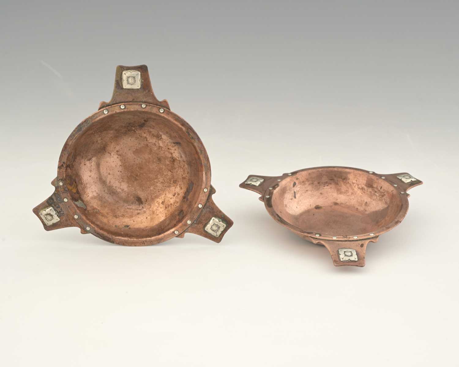 Lot 96 - A E Jones, a pair of Arts and Crafts silver...