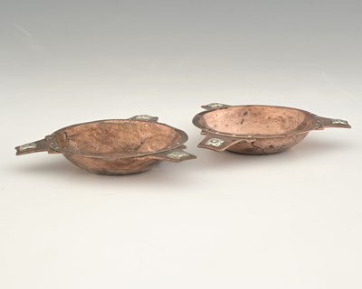 Lot 96 - A E Jones, a pair of Arts and Crafts silver...