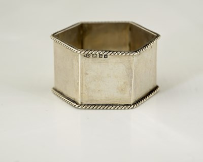 Lot 76 - Sibyl Dunlop, an Arts and Crafts silver napkin...