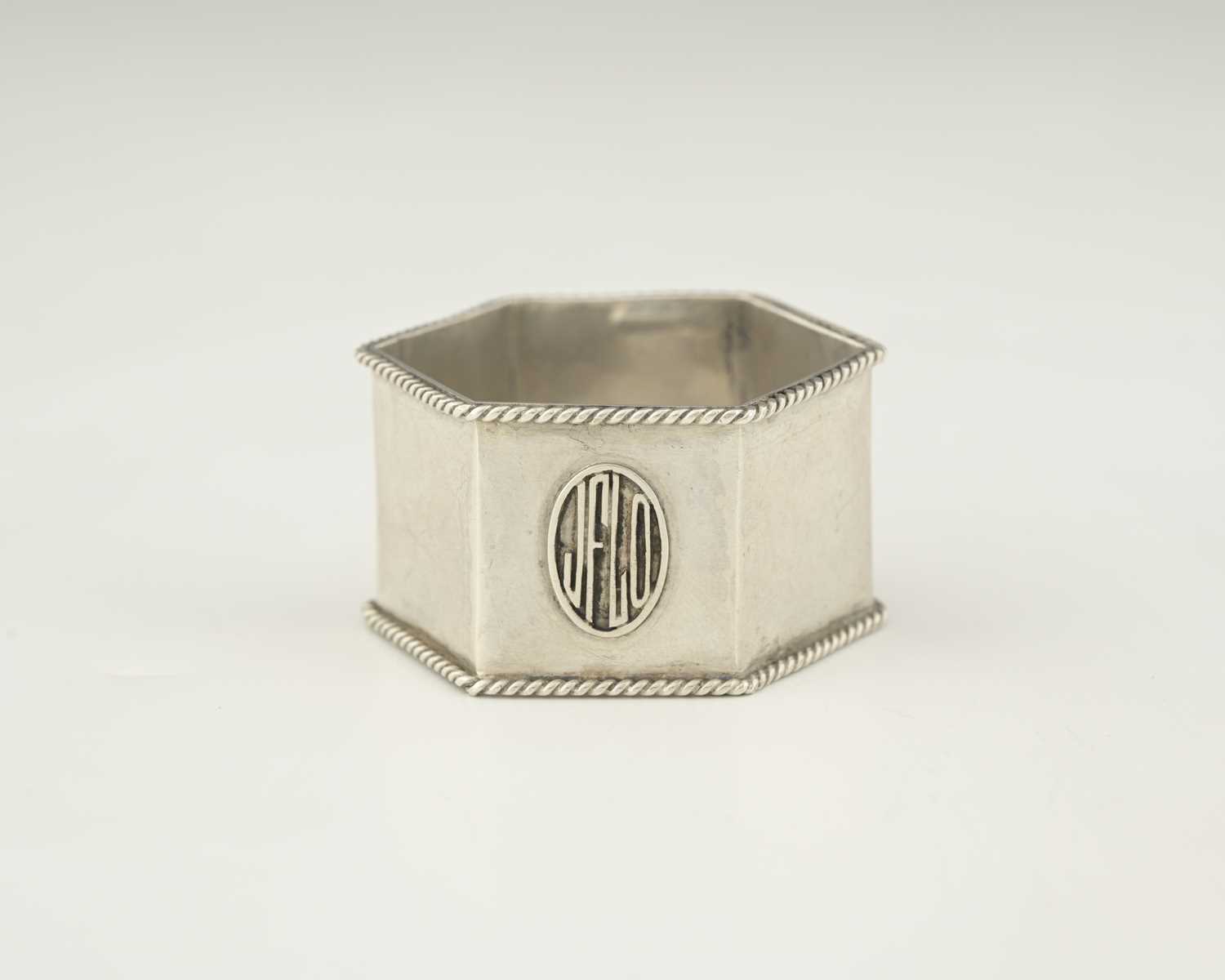 Lot 76 - Sibyl Dunlop, an Arts and Crafts silver napkin...