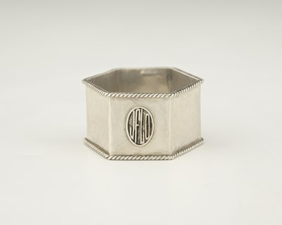 Lot 76 - Sibyl Dunlop, an Arts and Crafts silver napkin...