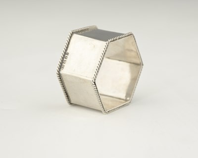 Lot 76 - Sibyl Dunlop, an Arts and Crafts silver napkin...