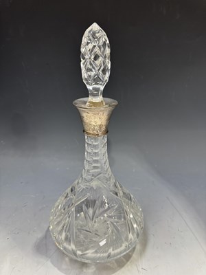 Lot 176 - A silver mounted cut glass ships decanter,...