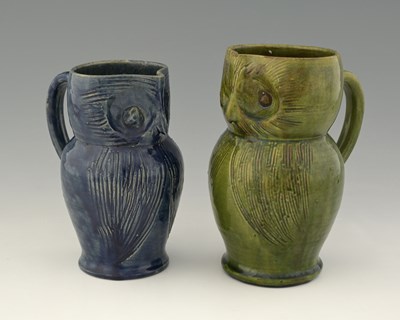 Lot 483 - Two Farnham art pottery owl jugs, green and...