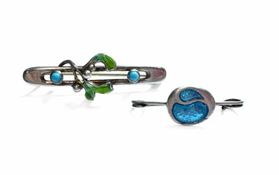Lot 460 - Two early 20th century silver enamel brooches, one by Charles Horner