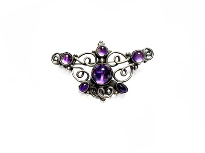Lot 464 - An Arts & Crafts silver amethyst brooch