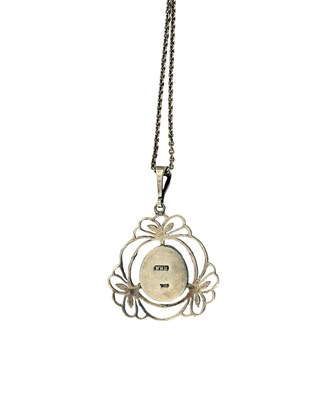 Lot 34 - Liberty & Co., an Arts & Crafts silver turquoise pendant, with chain