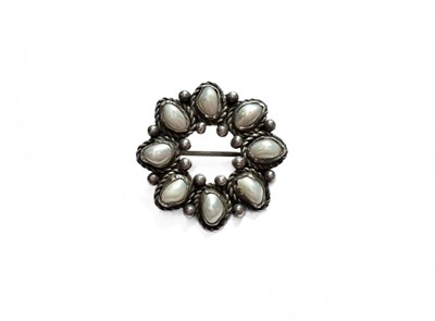 Lot 456 - An Arts & Crafts style silver pearl brooch