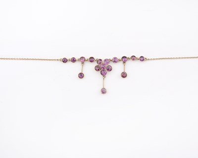 Lot 4 - An Edwardian 9ct gold pink gem floral fringe necklace