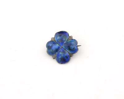 Lot 27 - James Fenton, an Art Nouveau silver enamel four leaf clover brooch