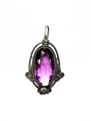Lot 477 - A Jugendstil white metal purple paste floral pendant