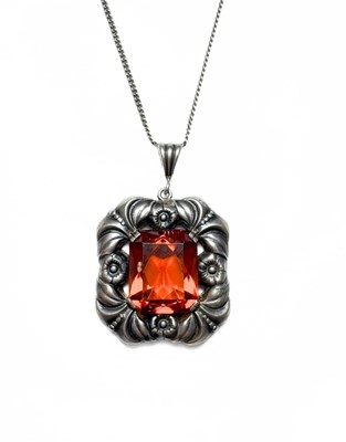 Lot 492 - A mid 20th century silver orange paste floral pendant, with chain
