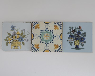 Lot 605 - Two English Delft polychrome floral tiles,...