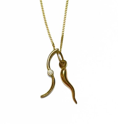 Lot 440 - An 18ct curb-link chain, with two pendants