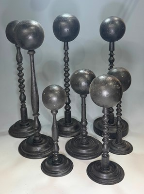 Lot 210 - A small quantity of black painted, turned...