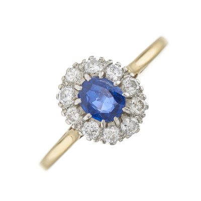 Lot 188 - An 18ct gold and platinum, sapphire and diamond cluster ring