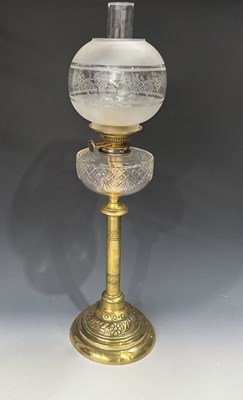 Lot 649 - An Arts and Crafts brass oil lamp, with an...